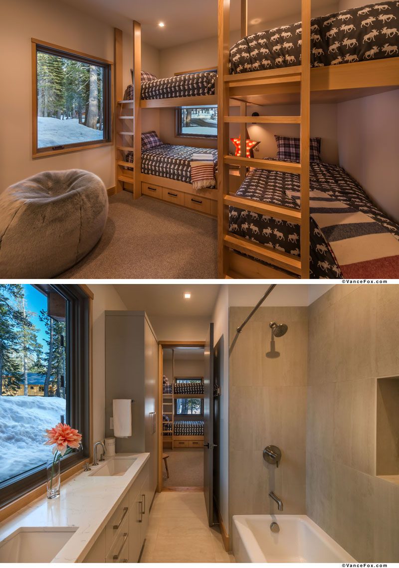 This bedroom has multiple bunk beds, allowing for four people to stay in the one room. Attached to the bedroom is an ensuite bathroom with a bath/shower combo and vanity that sits below the window. #Bedroom #BunkBeds #SleepingForFour #Bathroom