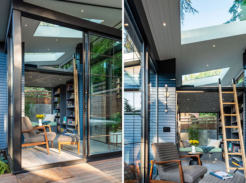 This modern backyard reading retreat (backyard studio), has a small patio, a sun-filled sitting area, a loft bed, a built-in bench, plenty of bookshelves, and a bathroom with a shower. #BackyardStudio #BackyardReadingRetreat #LoftBed #Skylight