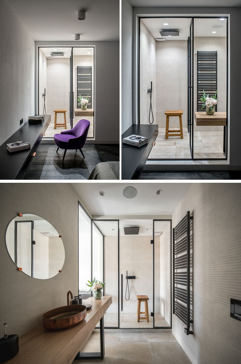 This modern bedroom has a view into the ensuite bathroom. #ModernBathroom #ModernBedroom #BathroomDesign