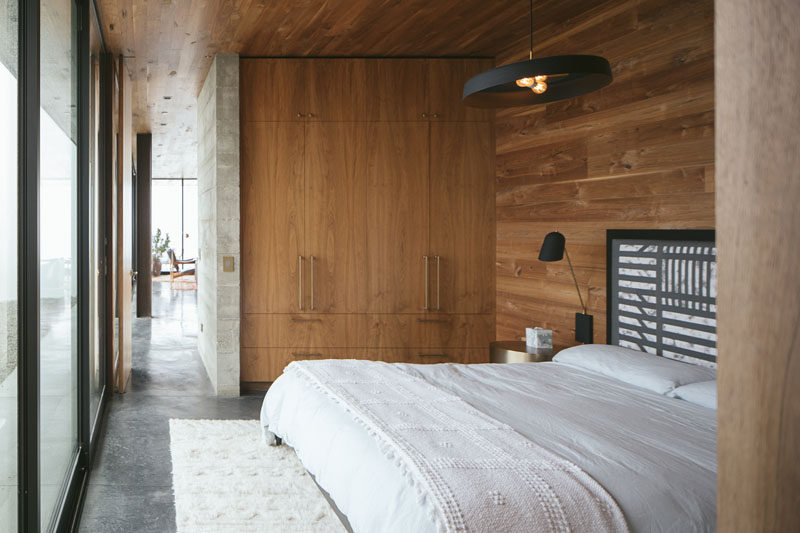 Rich walnut accents and custom fixtures and furnishings by Jessica Helgerson Interior Design add warmth and character to the this modern bedroom. #ModernBedroom #BedroomDesign