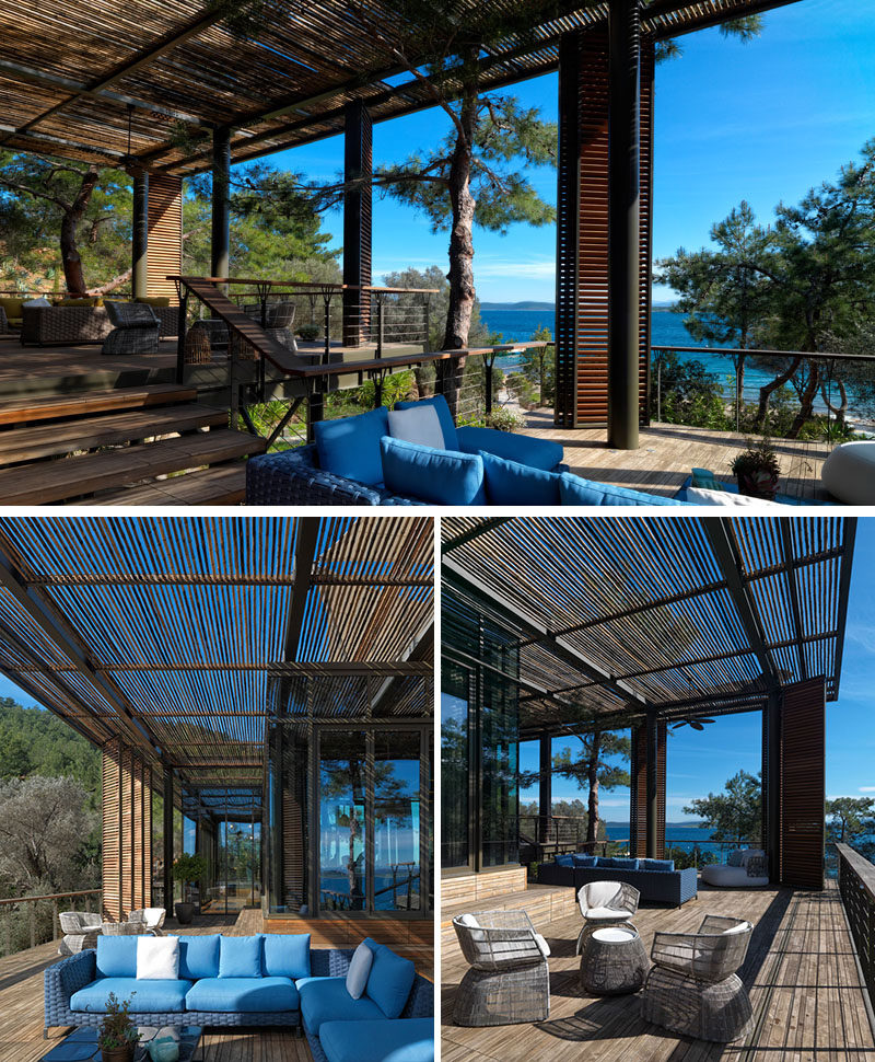 This modern club house has a pergola that's been designed with different levels, creating individual seating areas with waters views. #Pergola #Deck #ShadedOutdoorSpace