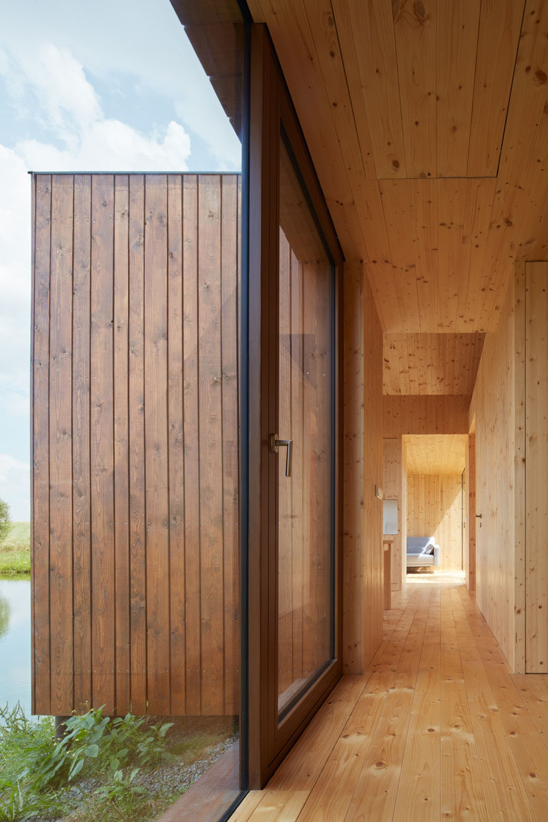 Atelier 111 have designed this small wood cottage that sits on the bank of a pond, and was inspired by traditional fisherman's cabins. #ModernCottage #ModernCabin #WoodCabin #Architecture