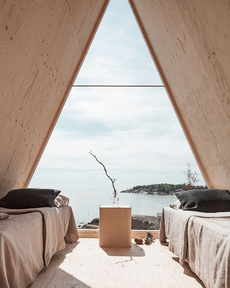 Robin Falck has designed a modern wood and mirrored cabin, that's located in the Finnish archipelago, on the Vallisaari island. #Cabin #ModernCabin #Design #Architecture