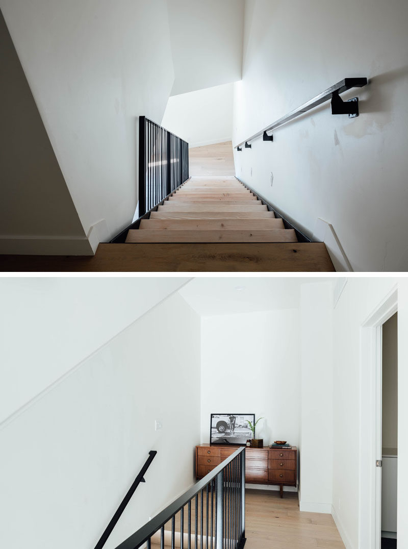 The wood and black steel stairs connect the various levels of this contemporary house, and at the top, there's a small alcove that furnished with a wood sideboard. #Stairs #InteriorDesign