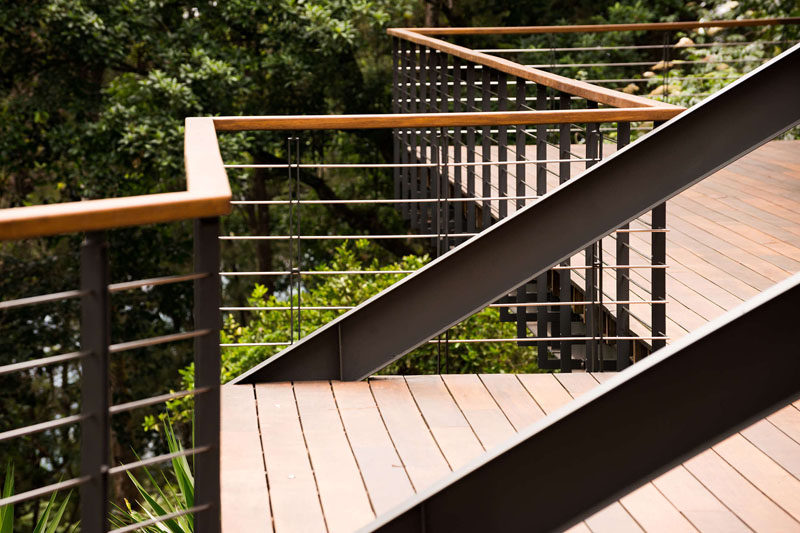 This balcony has a contemporary steel and wood railing. #Balcony #Railing