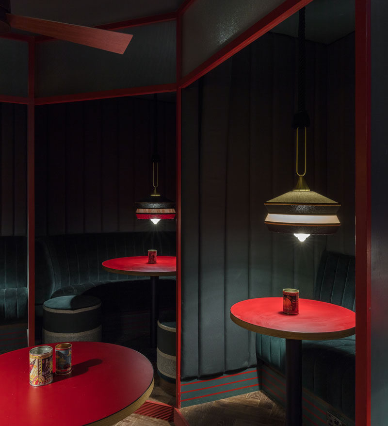This restaurant has a back room that's darker with a more indulgent in tone, lined with cosy and intimate private booths, from which customers can call the bar directly. #RestaurantDesign #RestaurantBooth