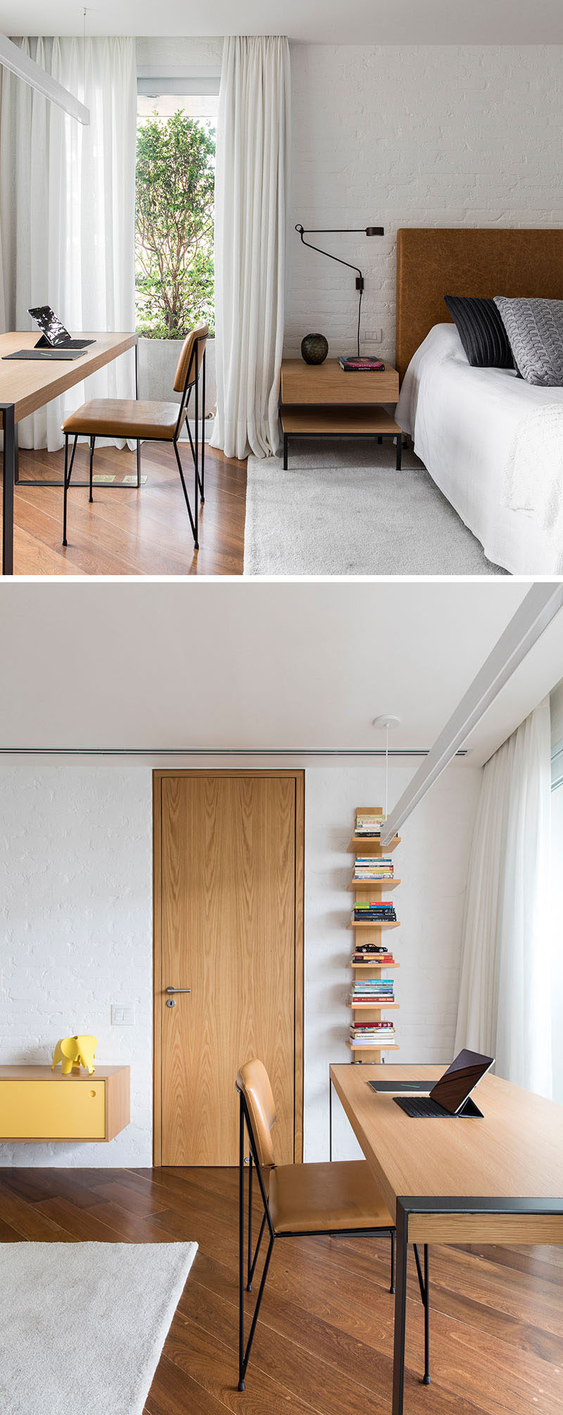 In this bedroom, there's a white painted brick wall, and a study area in front of the windows. An ensuite bathroom is located behind the wood door. #BedroomDesign #ModernBedroom #StudyDesk