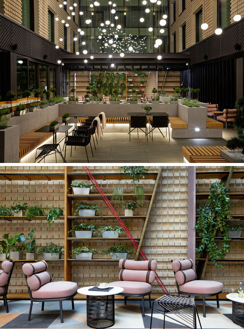 This modern hotel incorporates indoor and outdoor areas with private ‘pockets’ of space where guests can relax, like in the atrium. #Atrium #HotelDesign #Interiors