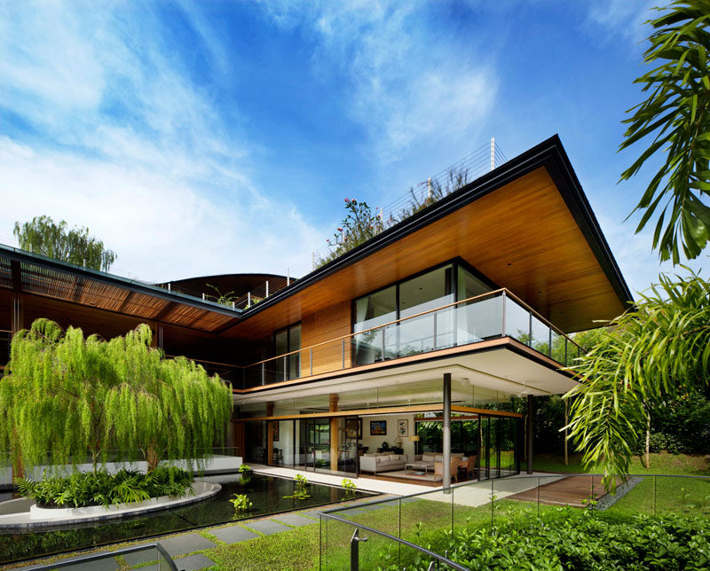 Guz Architects have designed the 'Ficus House', a modern residence in Singapore, that's been designed for a large family consisting of siblings, their families, and a parent. #Architecture #ModernHouse #Landscaping #LandscapeDesign