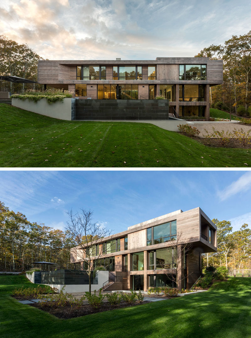 This modern house features exterior stairs lead from the pool level down to a patio area and the rest of the backyard. #ModernHouse #HouseDesign #Landscaping #Backyard