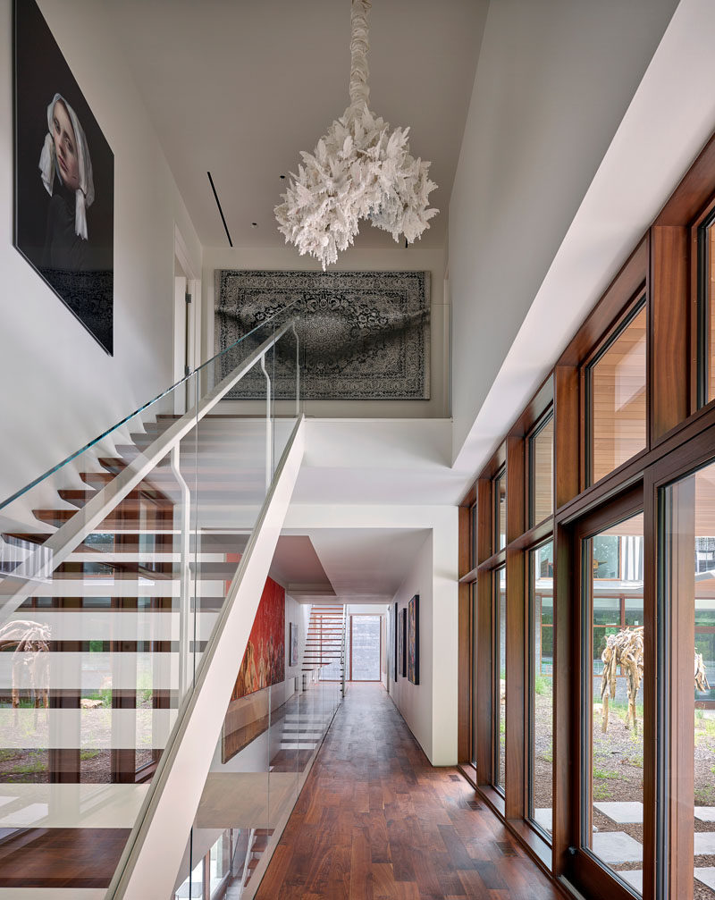 Multiple sets of stairs connect the various floors of this modern house. #Stairs #Hallway