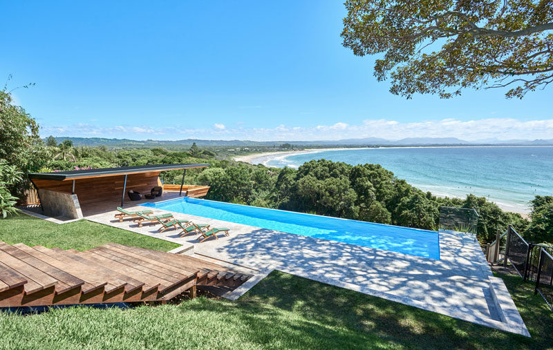 Harley Graham Architects have designed a modern pool cabana, that's clad in wood (Blackbutt), and takes the shape of a wave. #PoolCabana #ModernCabana #SwimmingPool