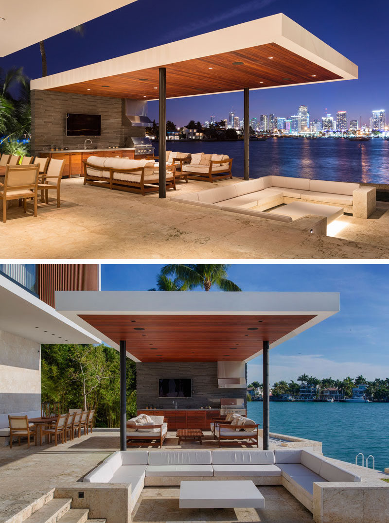 This modern outdoor space has a sunken outdoor living room that sits beneath the level of the pool, and is located between the pool and the outdoor summer kitchen and dining area. #Cabana #SunkenLounge #SunkenOutdoorLounge #OutdoorKitchen