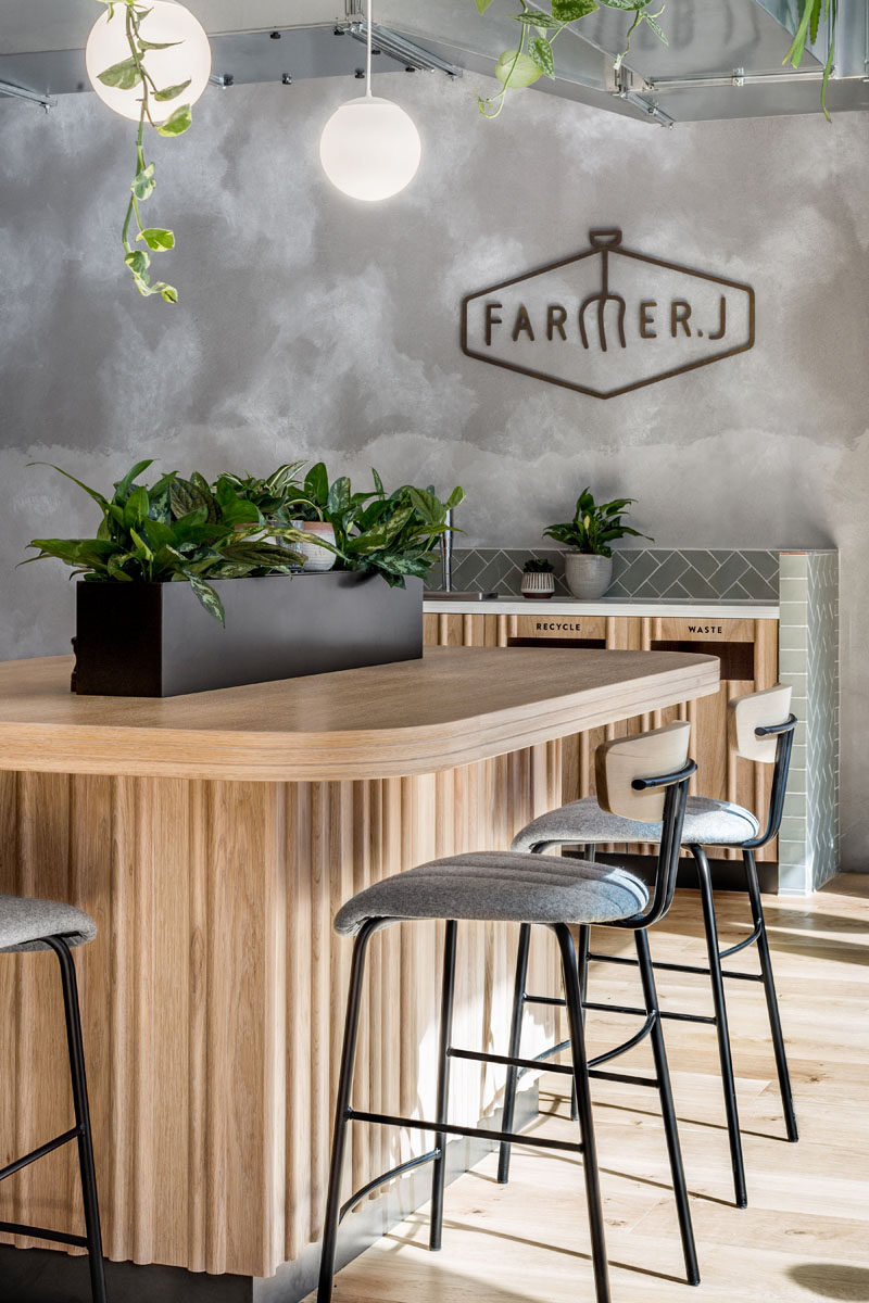 This modern restaurant has a lighter material palette enticing customers to the casual and relaxing interior. #RestaurantInterior #RestaurantDesign
