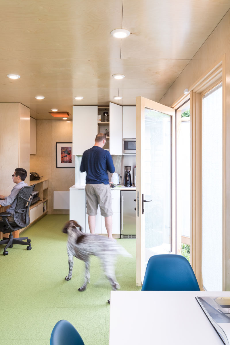 This shipping container office contains a kitchenette, washroom, printer / network cabinet and an open studio space. #HoemOffice #ShippingContainerOffice #OfficeDesign