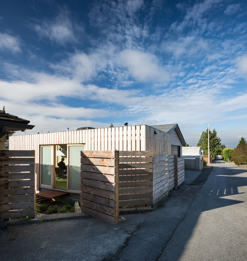 A cedar clad shipping container office sits quietly in this residential neighborhood. #ShippingContainerOffice #Achitecture