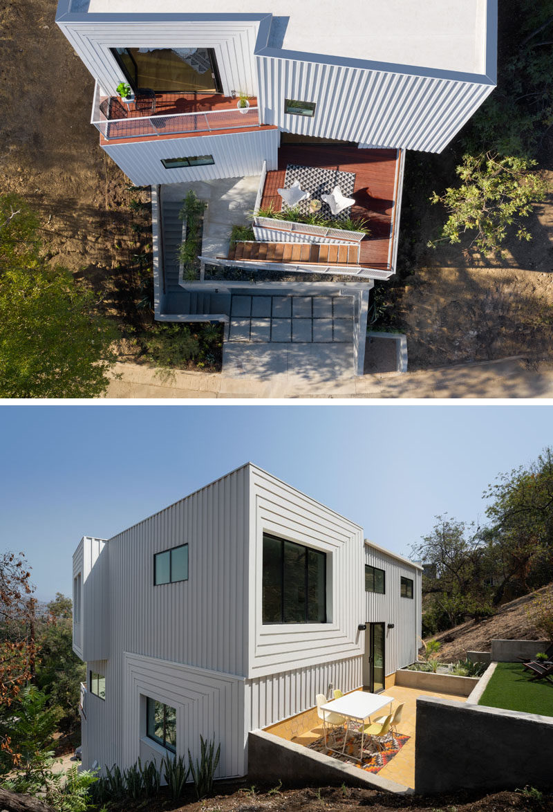 The siding of this modern house has been painted in subtle gradations from white to gray, allowing the striped shadows of the board-and-battens to shift throughout the day. #ModernHouse #WhiteSiding #OutdoorSpaces #Architecture