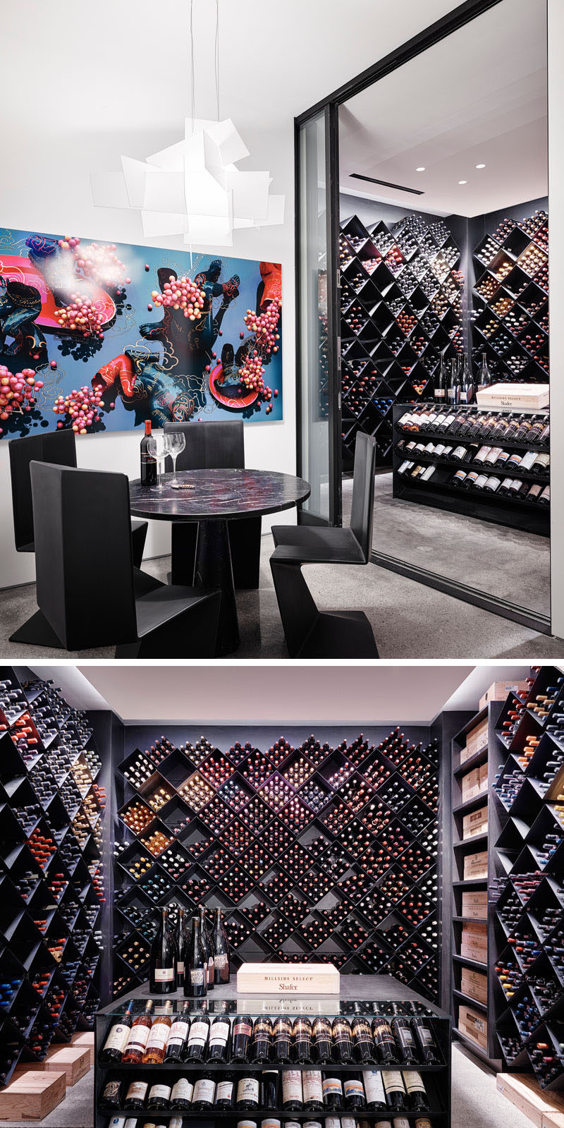 This modern wine cellar has a sliding glass door that opens to an extensive wine collection that's housed within diamond-shaped shelving, while an island provides a place to display selected bottles. #WineCellar #ModernWineCellar #WineStorage