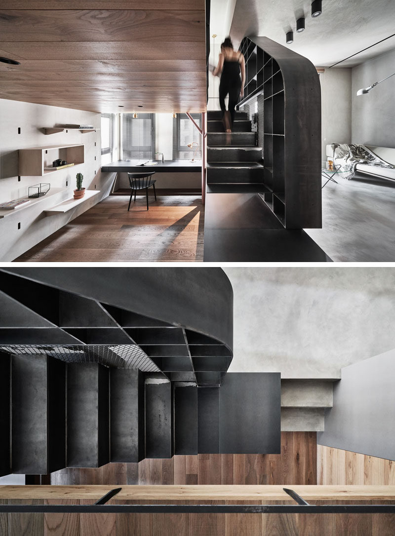 Steel stairs separate the living space and the home office of this modern apartment, and also lead up to the mezzanine. #SteelStairs #Stairs #ModernApartment