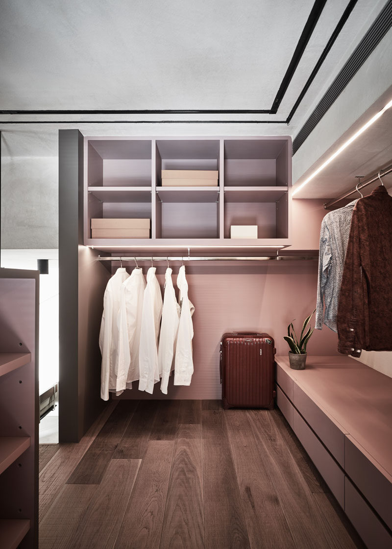 This modern bedroom features an open closet with custom shelving and built-in lighting. #Closet #OpenCloset