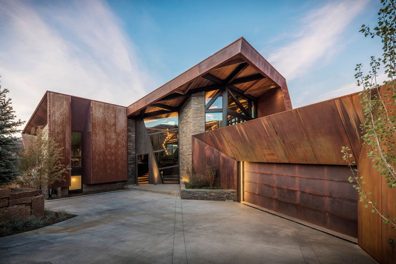 Perched on a hillside, with panoramic views of Snowmass Mountain, the Owl Creek Residence features an exterior of glass, wood, stone, and rusted steel. #Architecture #HouseDesign #ModernHouse