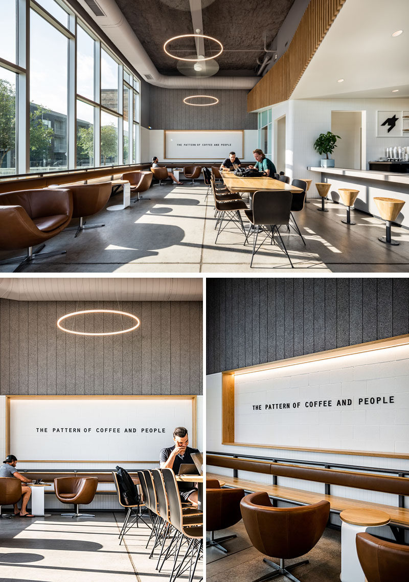 Stepping inside this modern coffee shop, there's a large custom designed communal table that sits beside a row of swiveling lounge chairs and a floating bench with a leather backrest. #ModernCoffeeShop #ModernCafeDesign #InteriorDesign