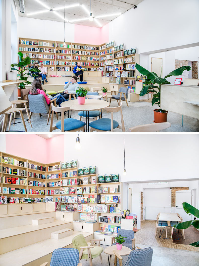 At one end of this coffee shop / bookshop is stadium seating that's surrounded by bookshelves that line the walls. The stadium seating allows customers to peruse the books and overlook the coffee shop. #StadiumSeating #CoffeeShop #TieredSeating