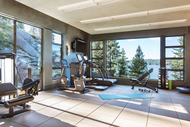 This modern house has a gym that takes advantage of the water views. #HomeGym