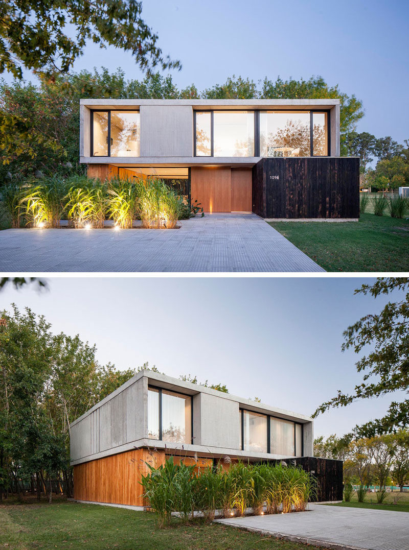 This modern house been built using wood for the lower floor, and a concrete upper floor with large windows. The boards of the formwork used for the execution of the walls of concrete, were blackened (Shou Sugi Ban) and reused on the facade. #ModernHouse #HouseDesign #ModernArchitecture #BlackenedWood