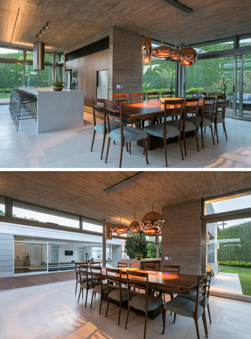 This dining area features a large wood dining table that has enough room for 12 people. #DiningRoom #LargeDiningTable