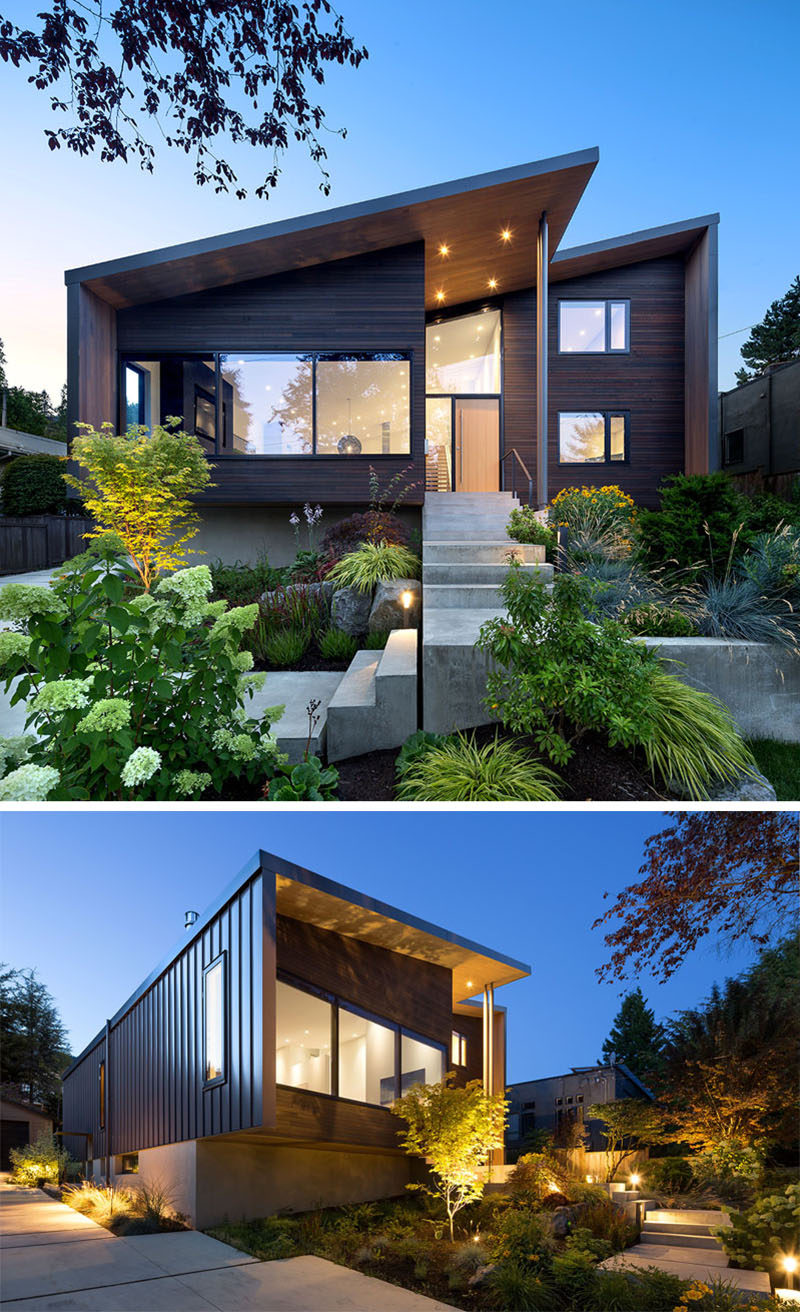 The front of this modern house benefited from new and modern landscaping that surrounding concrete steps that lead from the street to the front door. #ModernHouse #ModernLandscaping #ModernArchitecture