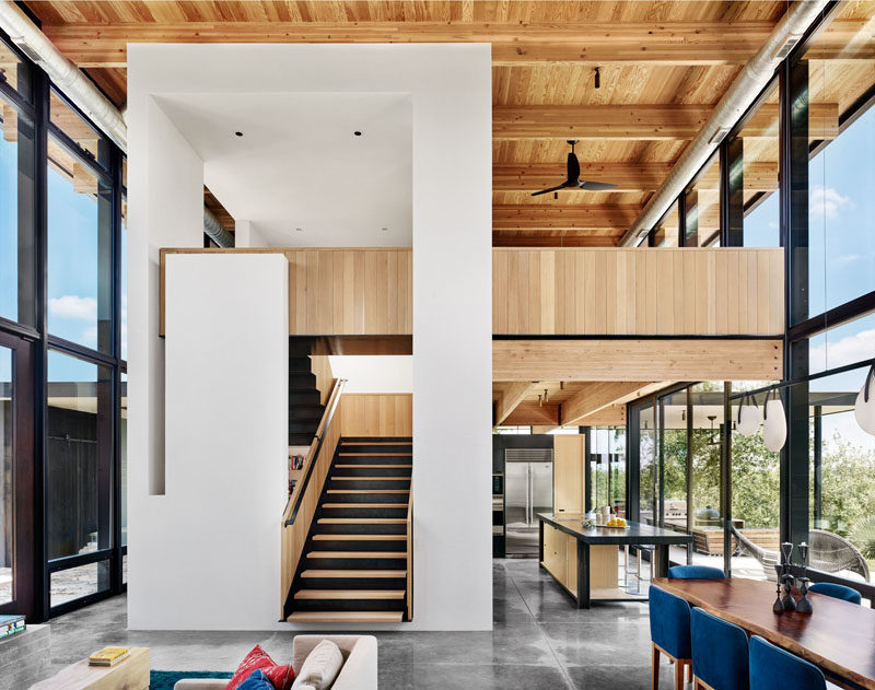 Wood, steel, and glass are all used in the design of this modern vacation home. #InteriorDesign #Stairs #HouseDesign