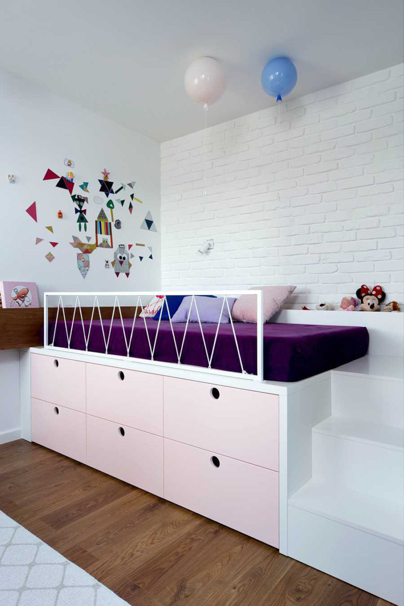 These modern kids bedrooms have raised beds with storage, and custom designed play areas. #KidsRoom #ChildsBedroom #ModernKidsRoom