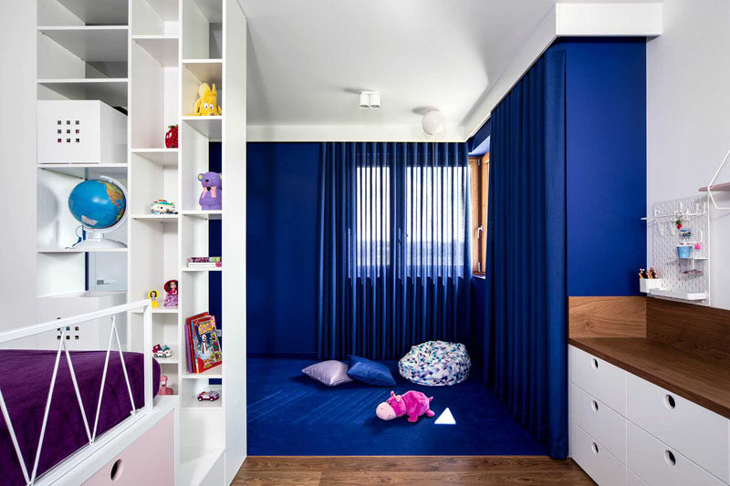These modern kids bedrooms have raised beds with storage, and custom designed play areas. #KidsRoom #ChildsBedroom #ModernKidsRoom
