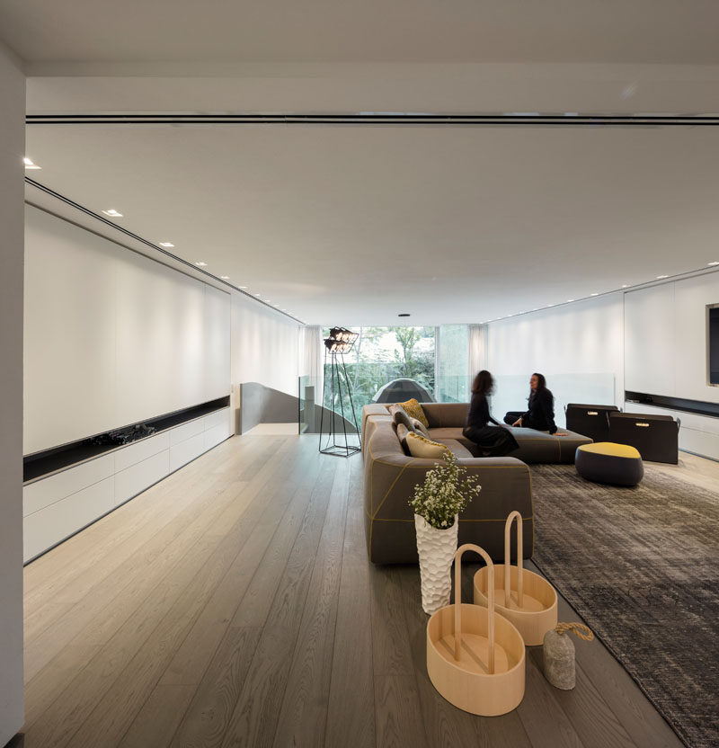 This modern house has a mezzanine that's been furnished as a secondary living room. #Mezzanine #LivingRoom