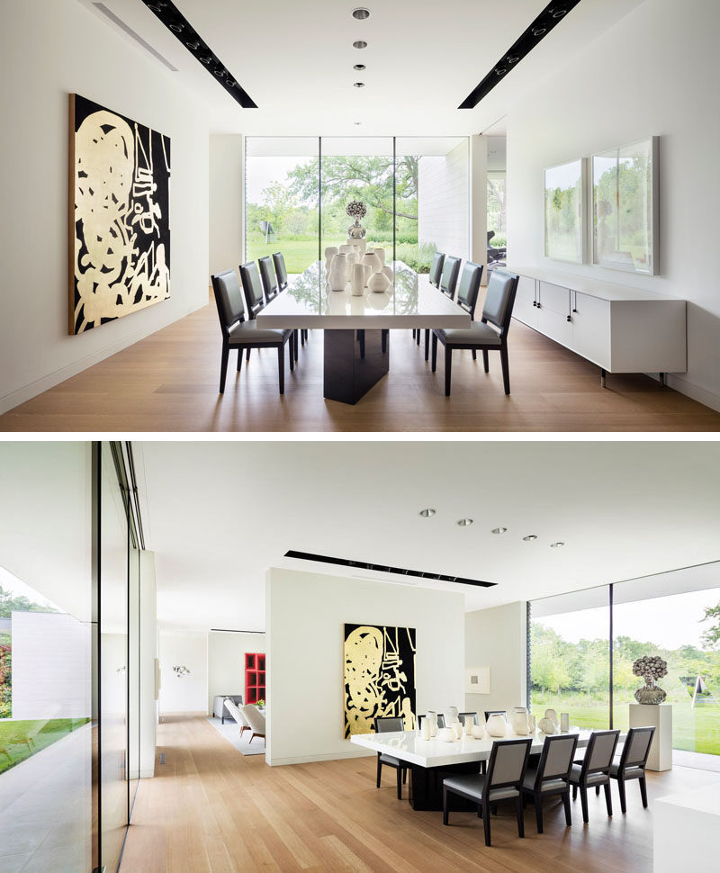 Large white walls reminiscent of a gallery, are used throughout this modern house to highlight the artwork. #DiningRoom #InteriorDesign