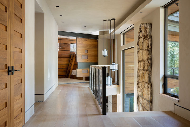 Various wood doors feature throughout this contemporary lakeside home. #WoodDoors #Doors