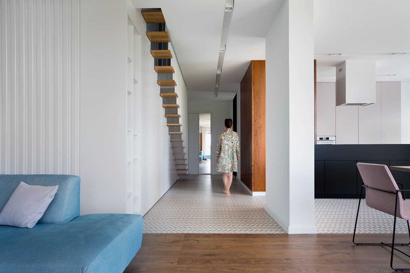 Patterned tile flooring was used to help define the kitchen and hallway in this modern house. #PatternedFlooring #TileFlooring #PatternedTile