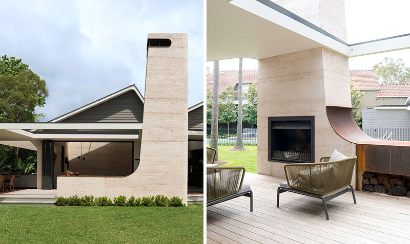 This house has a 22 foot (7m) high rammed earth chimney for an outdoor fireplace that sits beside an open air living room. #Fireplace #OutdoorFireplace