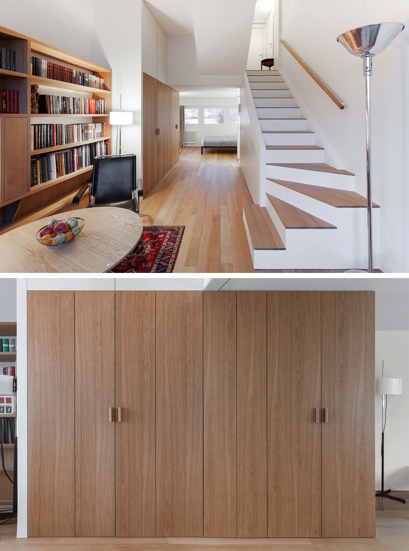 This small and modern apartment hides the kitchen, storage, and a laundry within a wood closet in the hallway. #InteriorDesign #SmallKitchen #HiddenKitchen #HiddenLaundry