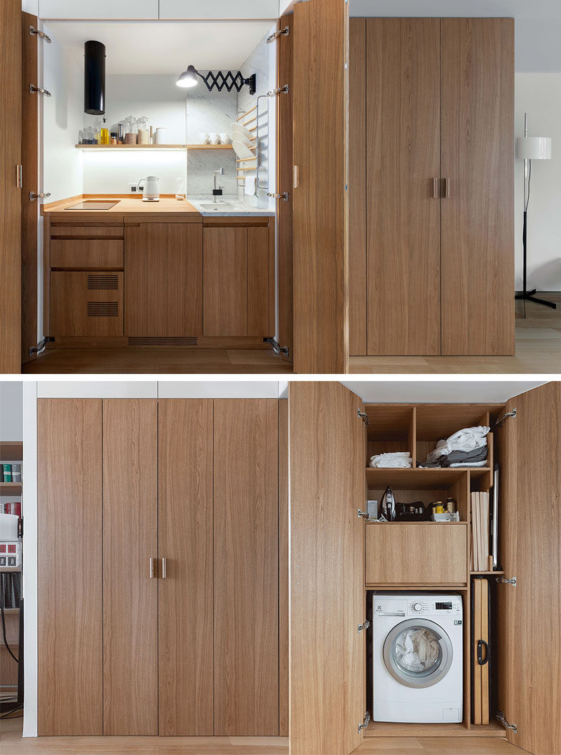 This small and modern apartment hides the kitchen, storage, and a laundry within a wood closet in the hallway. #InteriorDesign #SmallKitchen #HiddenKitchen #HiddenLaundry