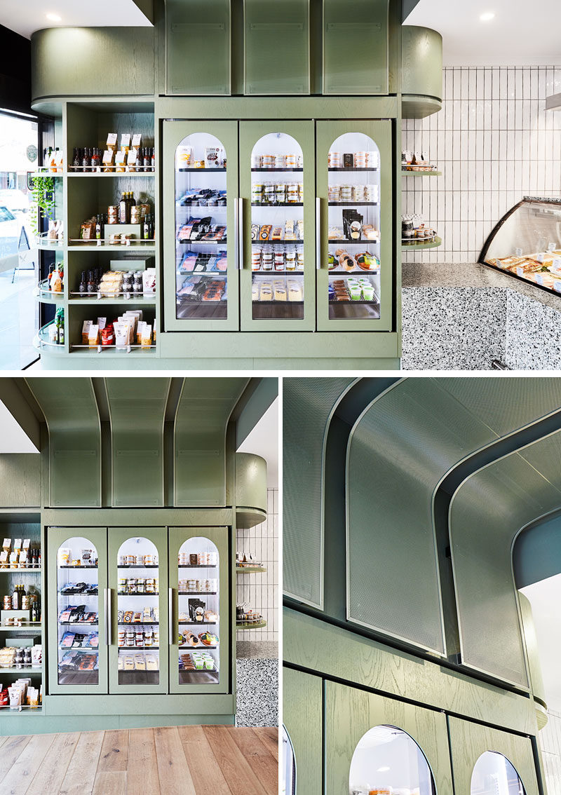 This modern butcher features backlit fridges with arched details, open shelving, and a curved ceiling detail that wraps from one side of the butcher, up onto the ceiling, and down to the opposite wall. #ModernButcher #RetailDesign #RetailDisplay #InteriorDesign