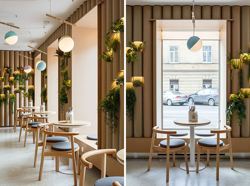 Cardboard tubes have been used to line some of the walls of this modern restaurant, creating a modern interpretation of a bamboo tree, which associated everywhere with the culture of Thailand, China and Japan. #ModernRestaurant #RestaurantDesign #CardboardTubes #WindowSeating