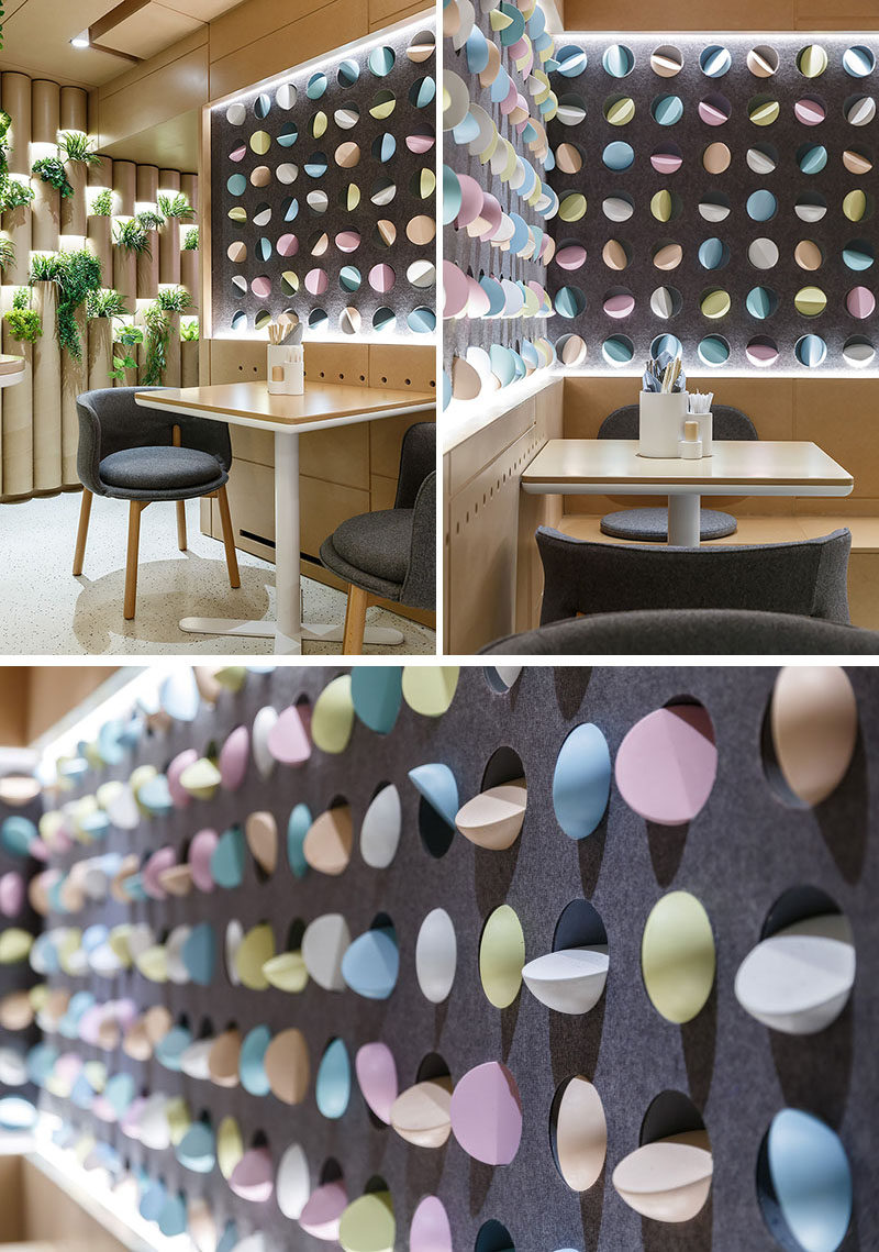 The walls of this modern restaurant are have wall niches decorated with colorful Mochi-shaped elements. #WallAccent #ModernRestaurant #InteriorDesign