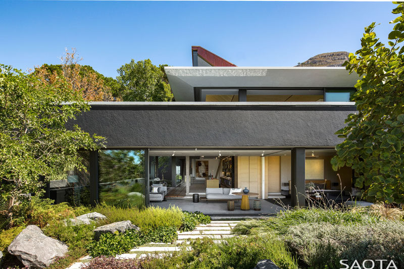 SAOTA have designed a modern family home in Cape Town, South Africa, that sits below Lion’s Head, and has sweeping views of the surrounding area. #ModernHouse #HouseDesign #Landscaping