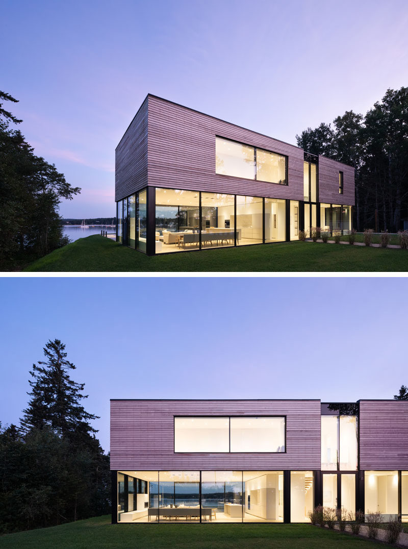 The exterior of this modern house is clad in red cedar-clad horizontal boards that hover above a glass-encased ground level. #ModernHouse #HouseDesign #ModernArchitecture