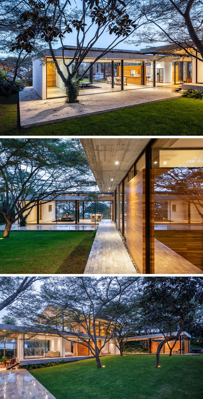 The interiors of this modern house open to a courtyard that showcases the natural topography and the original Algarrobos trees that were on the site. #Architecture #Landscaping #ModernHouse