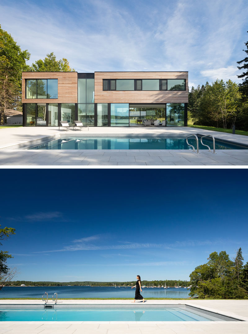 Massive sliding glass panels allow the heart of this modern house to open up to the swimming pool and deck. #ModernHouse #SwimmingPool #GlassWalls