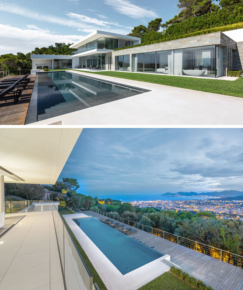 The main floor of this modern house opens up to a 20 meter long infinity pool, that has a lower deck to allow for uninterrupted views from the house. #ModernHouse #SwimmingPool #Landscaping