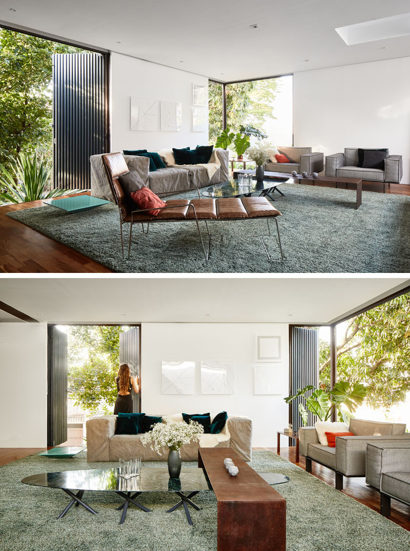 This second floor modern living room takes advantage of the miniwave panels on the exterior of the house, that control sunlight, acoustics and safety. #ModernLivingRoom #Windows